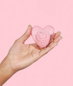 heart-shaped makeup sponge in model's hand